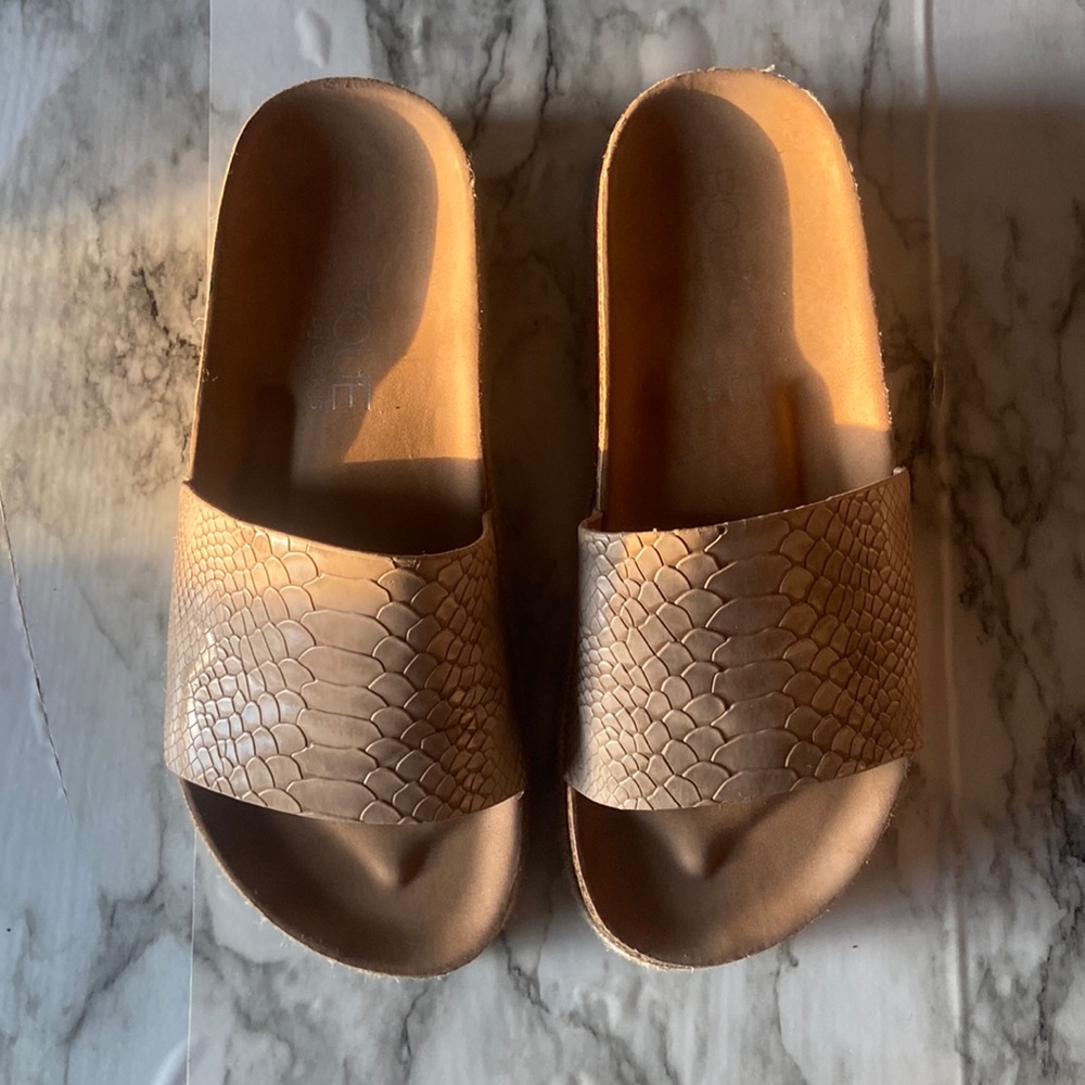 Snake Skin Boutique by Corky’s slides